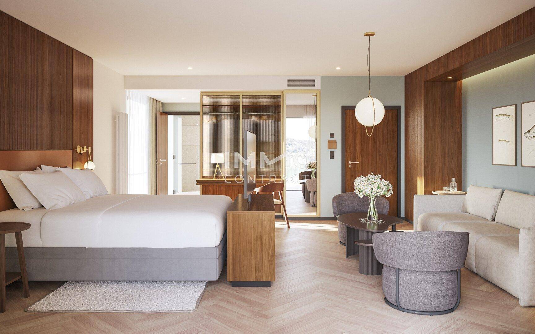 Modernes Schlafzimmer mit großem Bett, Sitzbereich und stilvoller Einrichtung in warmen Tönen.
