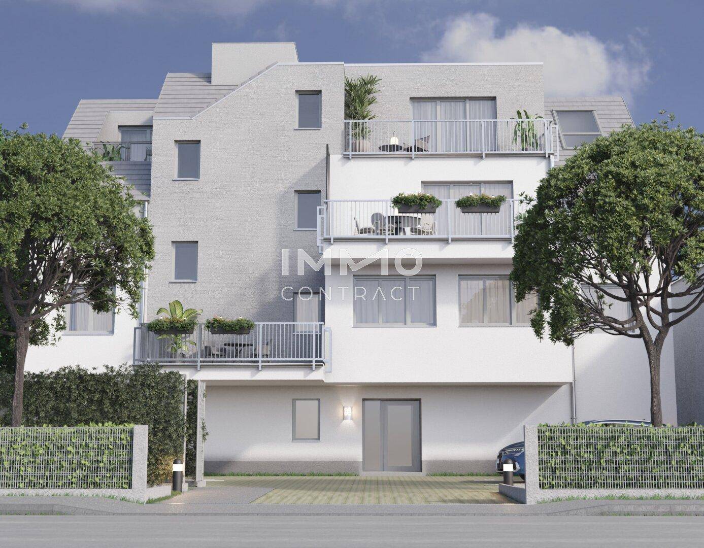 Zeitgenössisches Mehrfamilienhaus mit Balkonen, großen Fenstern und integrierter Parkmöglichkeit.