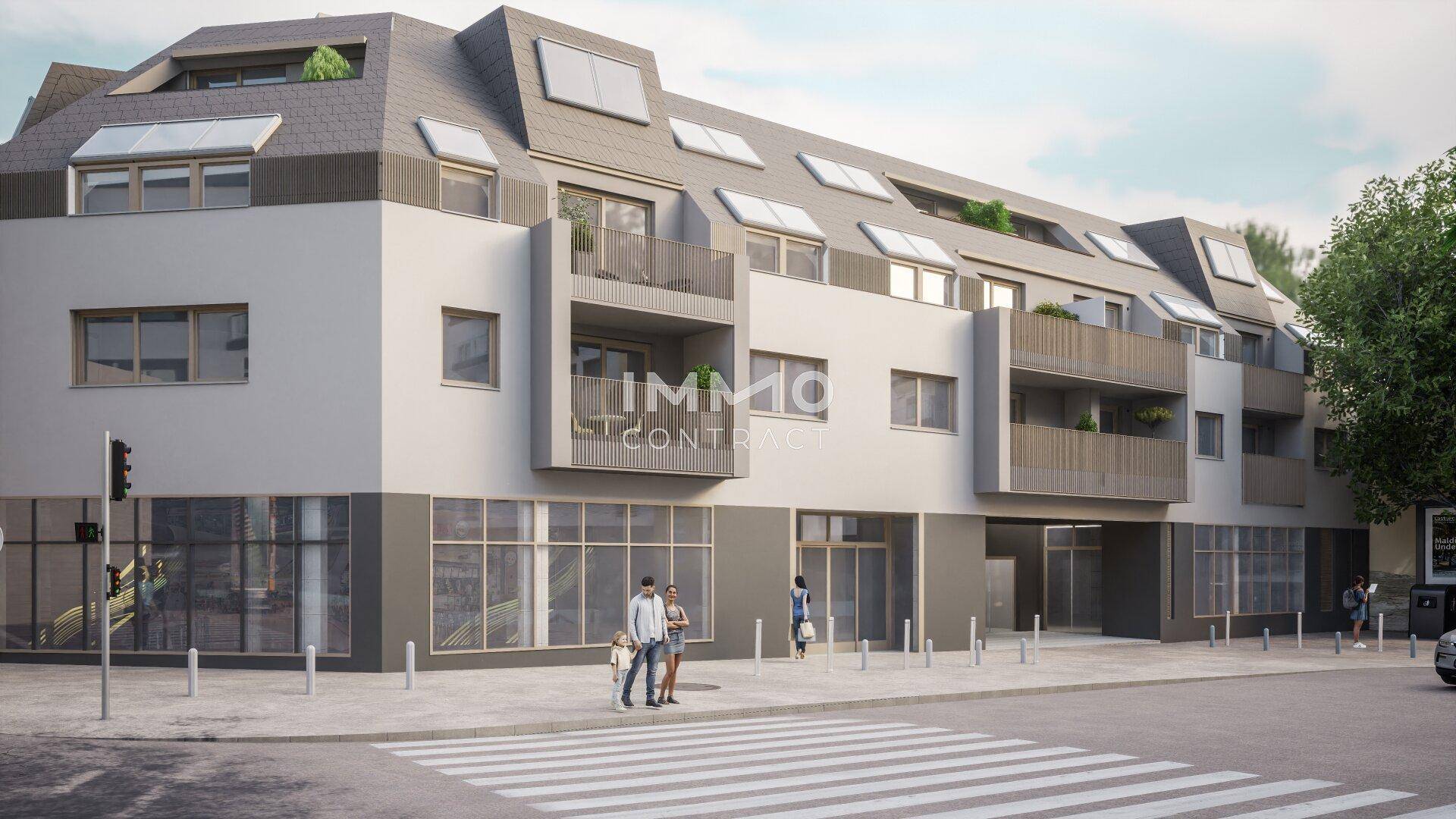 Ansicht der modernen Wohn- und Geschäftsfassade mit Mansarddach und großen Fensterfronten.