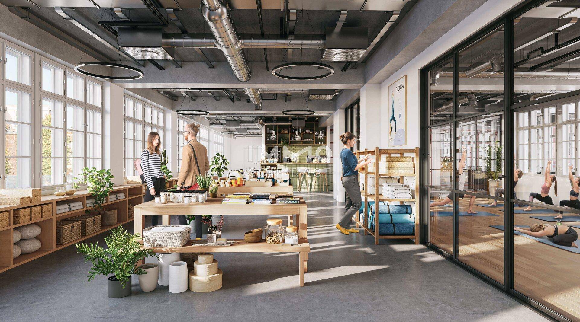 Vielseitiger Innenraum mit Verkaufsbereich, Yogastudio und industriellem Design.