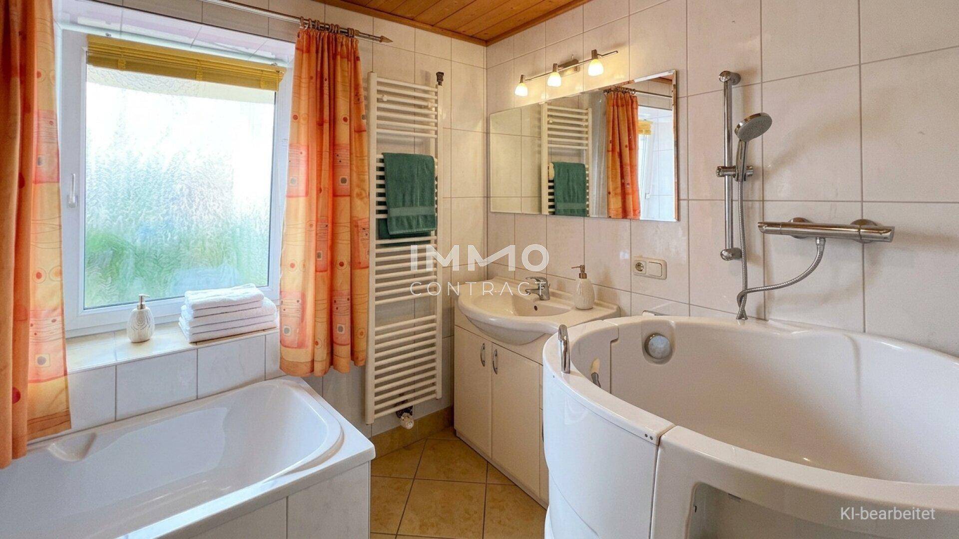 Badezimmer mit Badewanne, Eckbadewanne, Waschbecken und beheiztem Handtuchhalter.