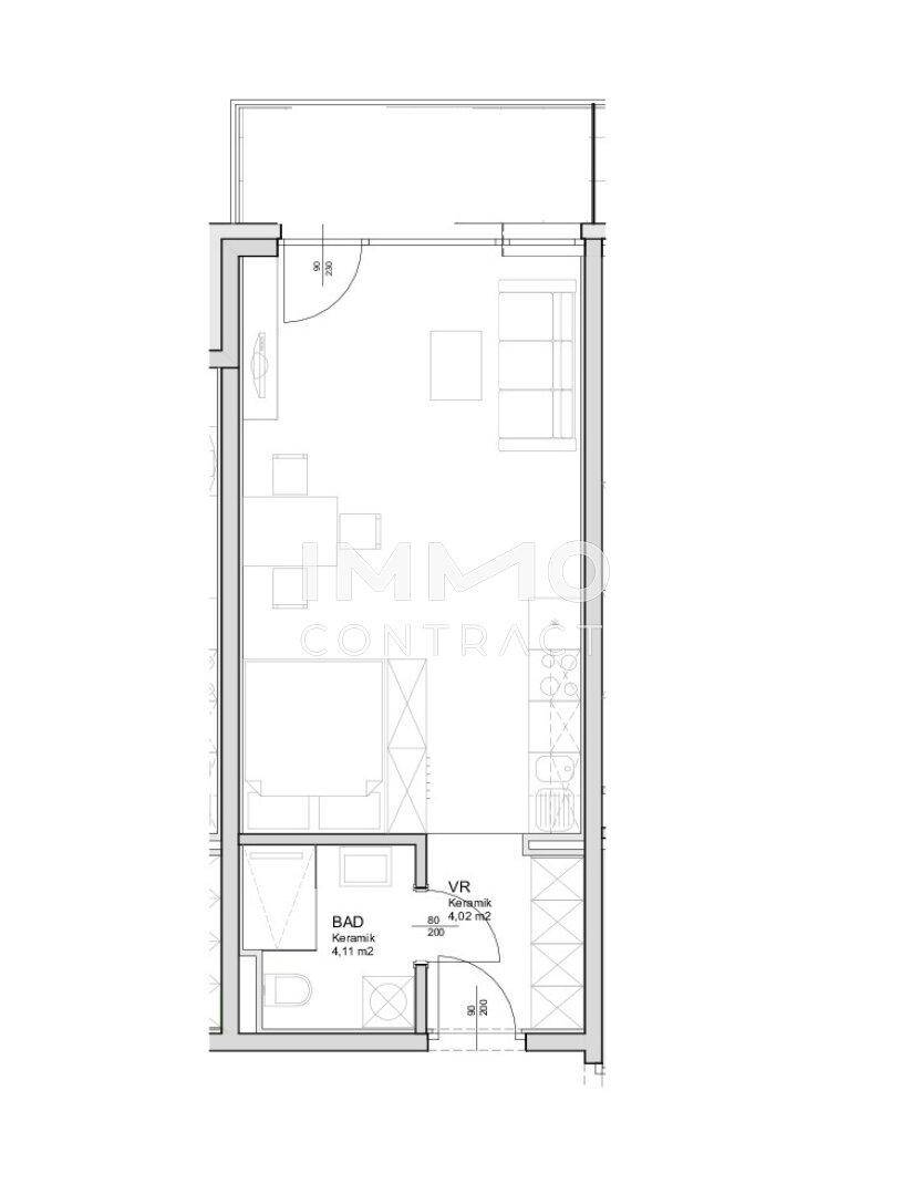 Grundriss einer Studio-Wohnung mit offenem Wohn-/Schlafbereich, integrierter Küche und Balkon.