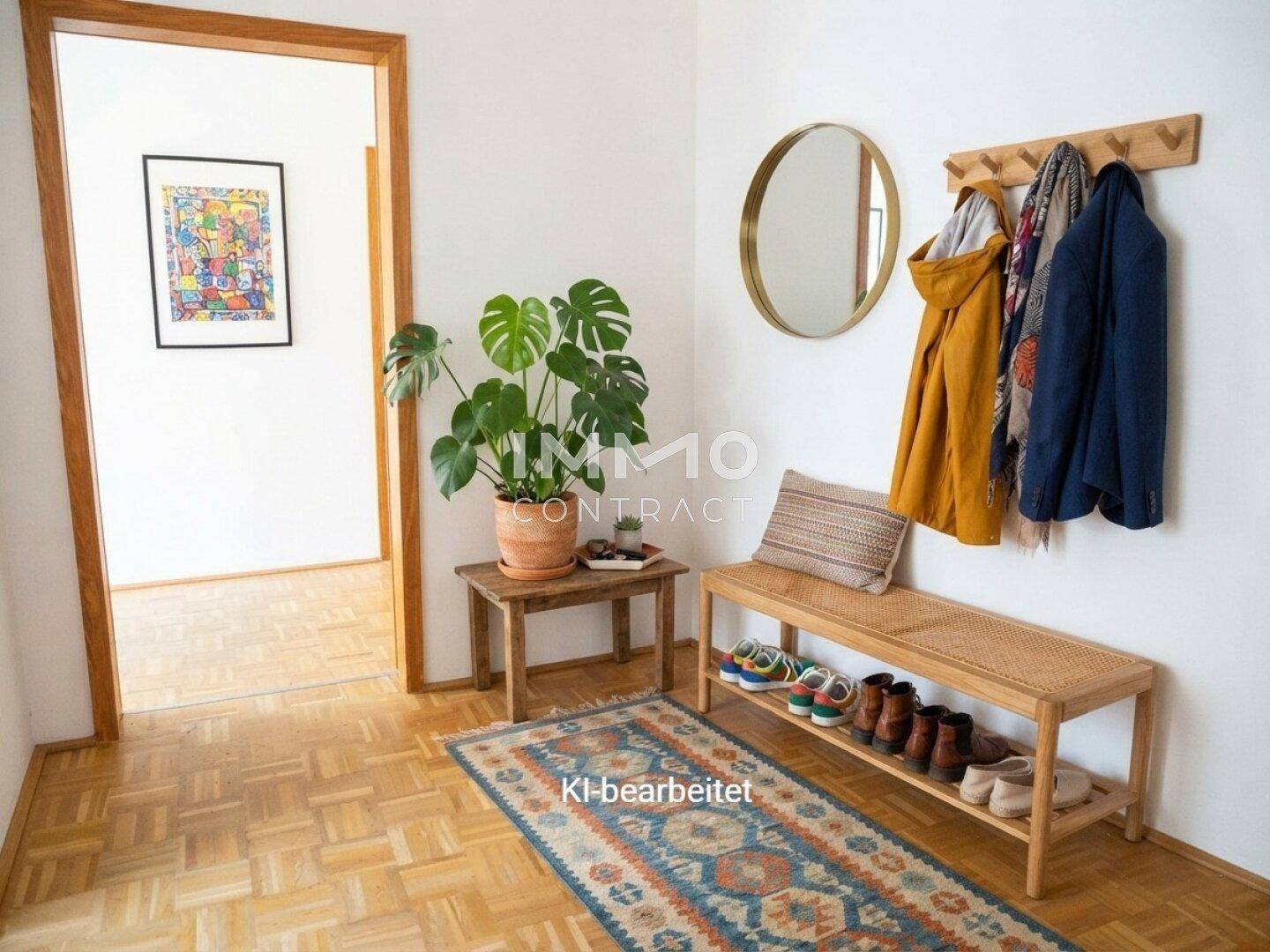 Einladender Flur mit Parkettboden, Garderobe, Sitzbank und einem dekorativen Spiegel.