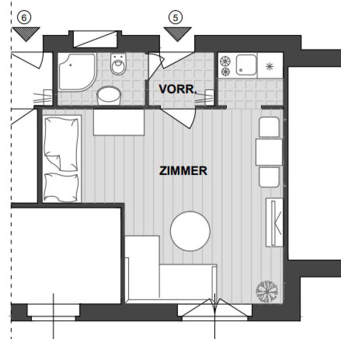Grundriss einer Wohneinheit mit Zimmer, Vorraum, Bad und Küchenzeile.