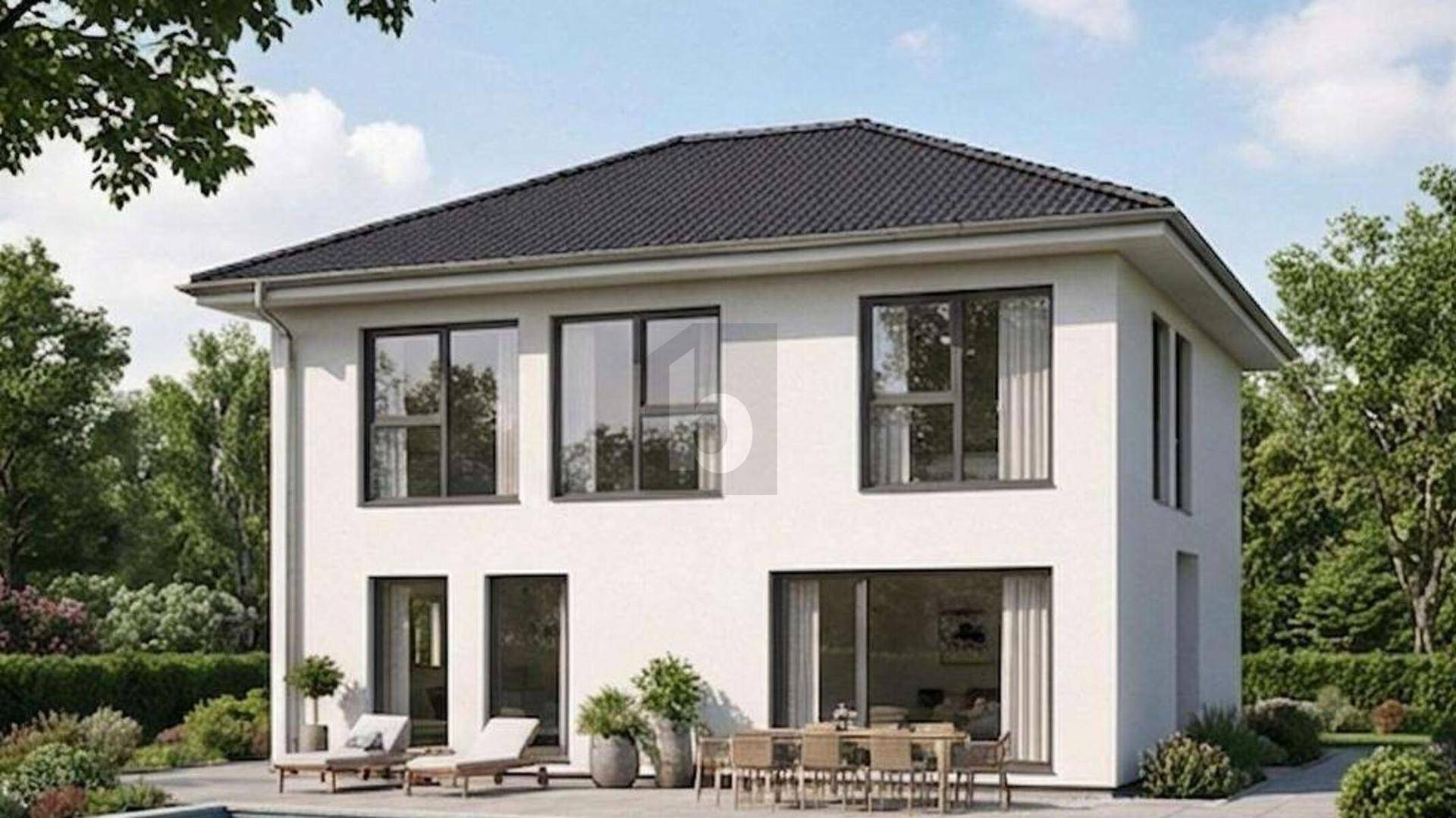 Freistehendes Einfamilienhaus mit moderner Architektur, Garten und Terrasse.