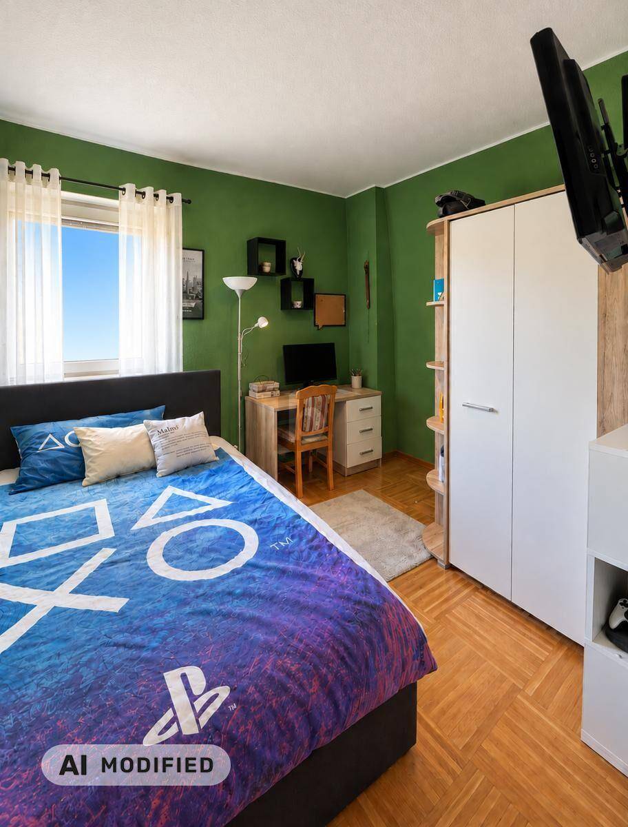 Jugendzimmer mit grünen Wänden, Bett und Schreibtischbereich mit Blick ins Grüne.