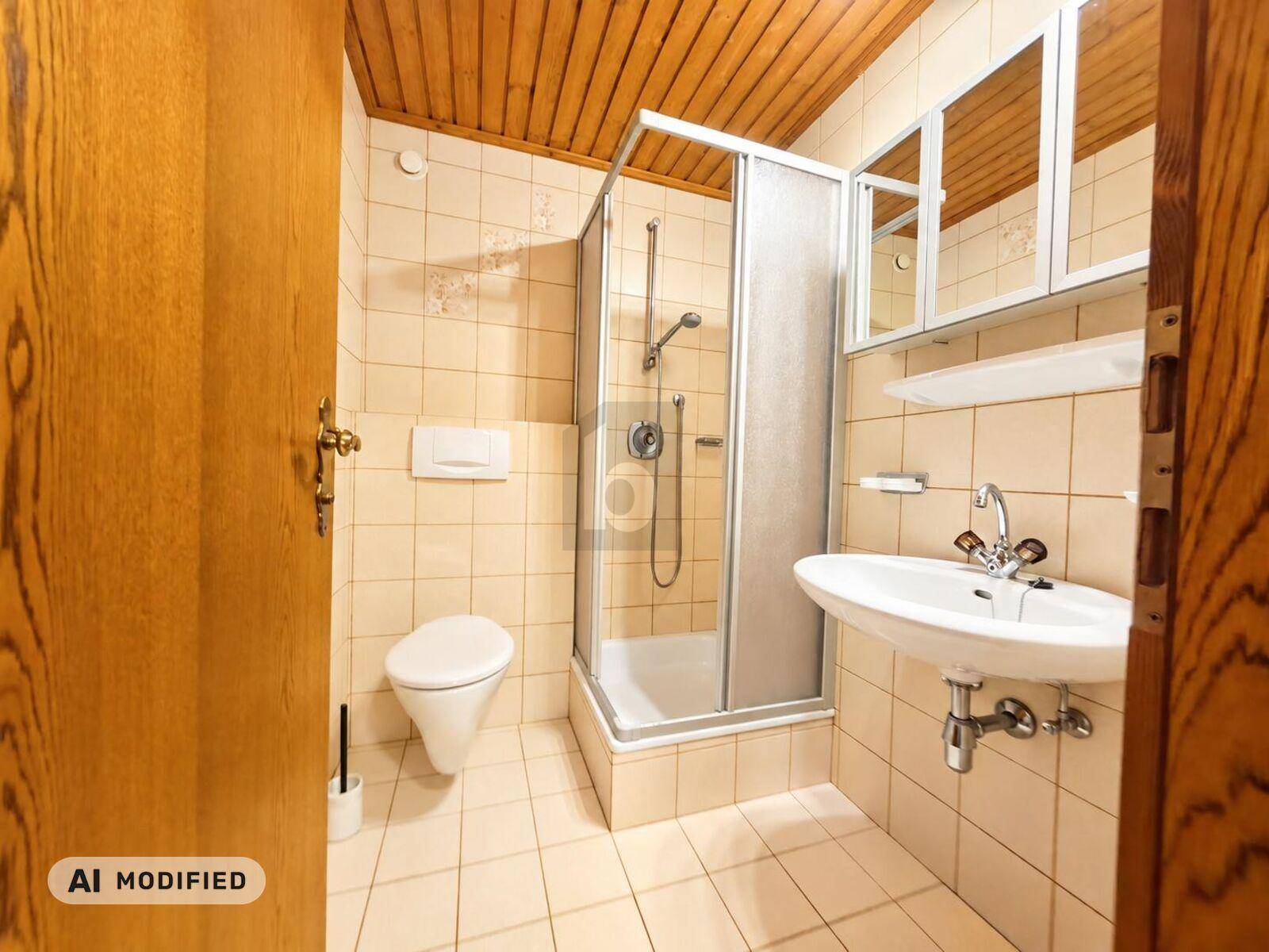 Funktionales Badezimmer mit Duschkabine, WC, Waschbecken und hellen Fliesen.