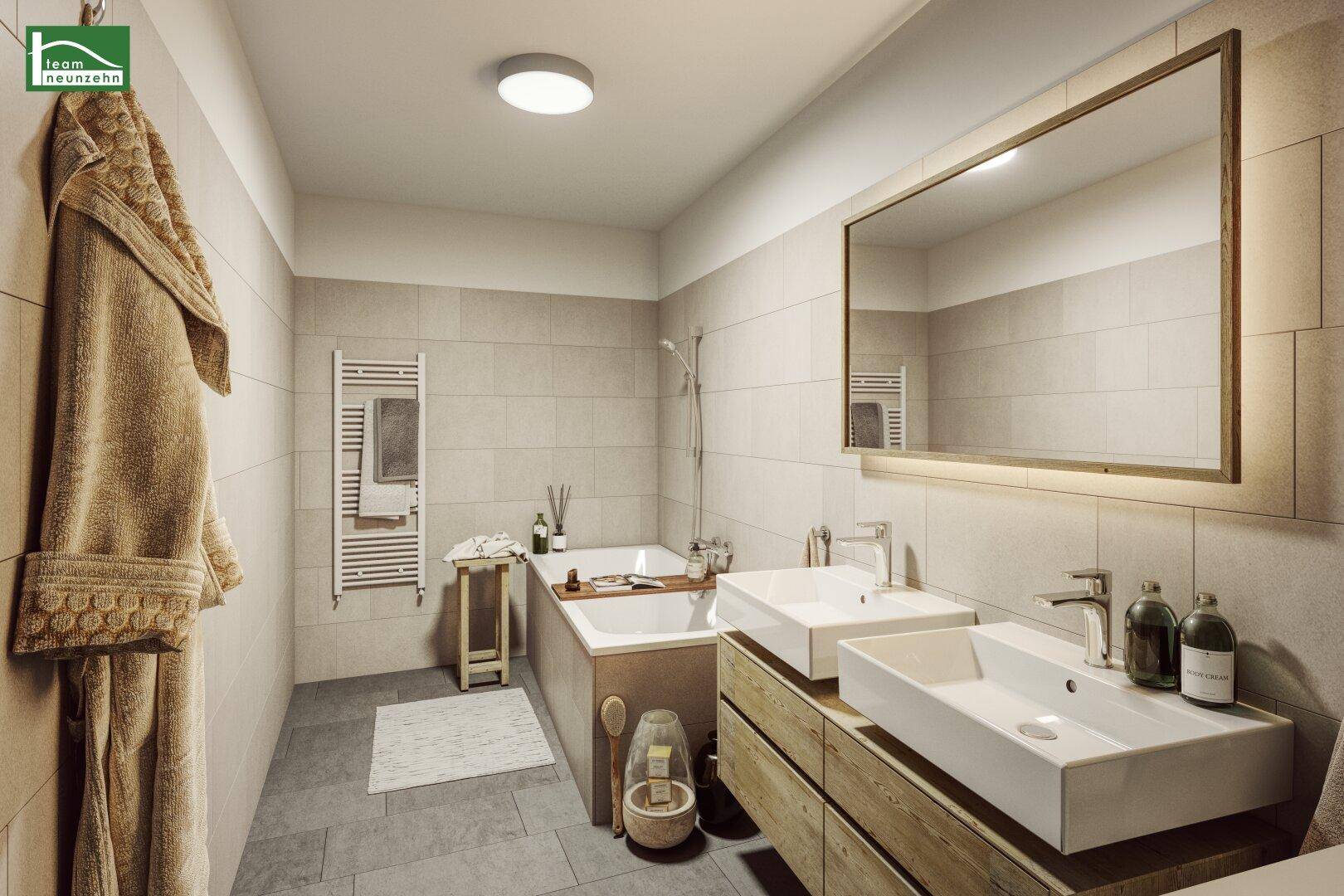 Modernes Badezimmer mit Badewanne, Doppelwaschbecken und beheiztem Handtuchhalter.