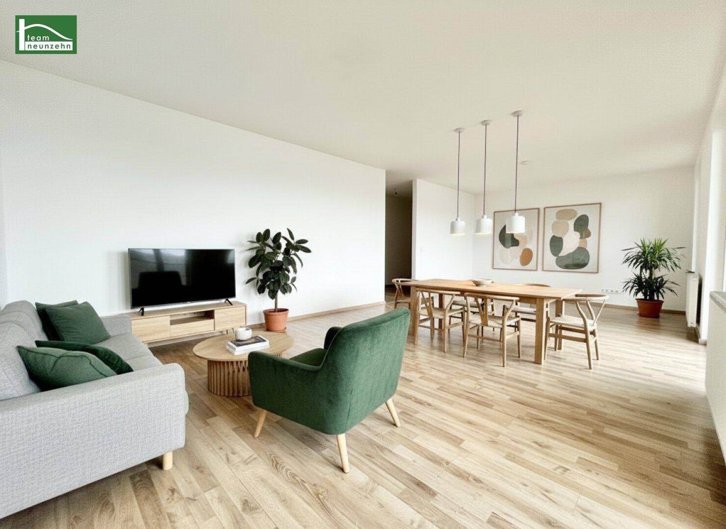 Heller, offener Wohn- und Essbereich mit modernem Design, Holzboden und viel Tageslicht.