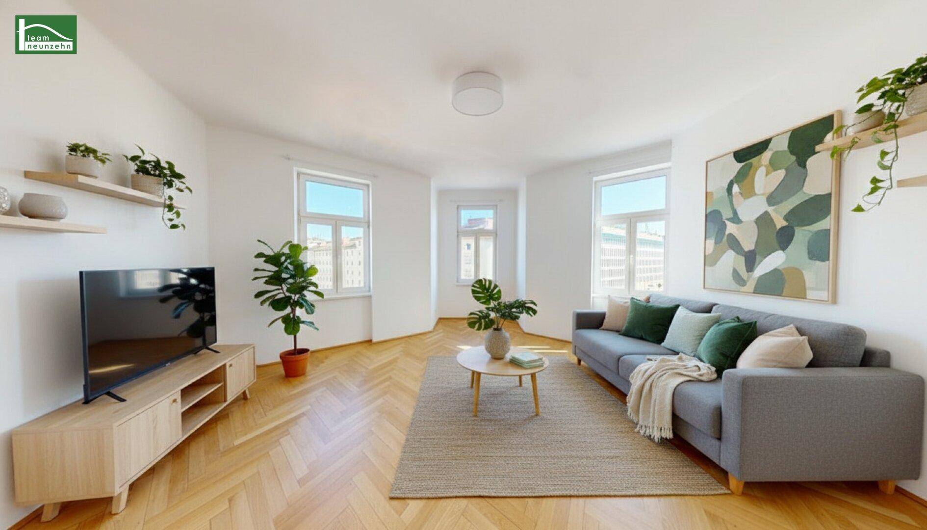 Gemütliches Wohnzimmer mit modernem Sofa, Fernseher und hellem Parkettboden.