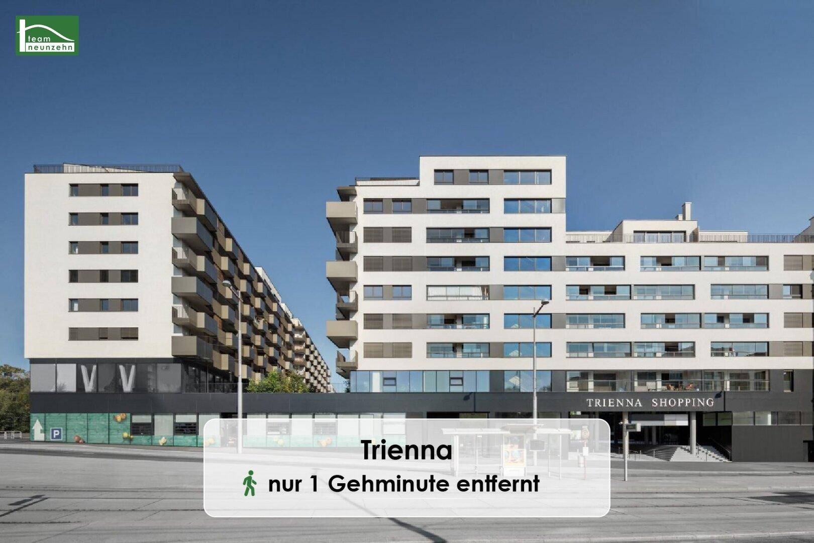 Moderne Wohn- und Geschäftsgebäude mit dem Trienna Shopping Center in einer städtischen Umgebung.