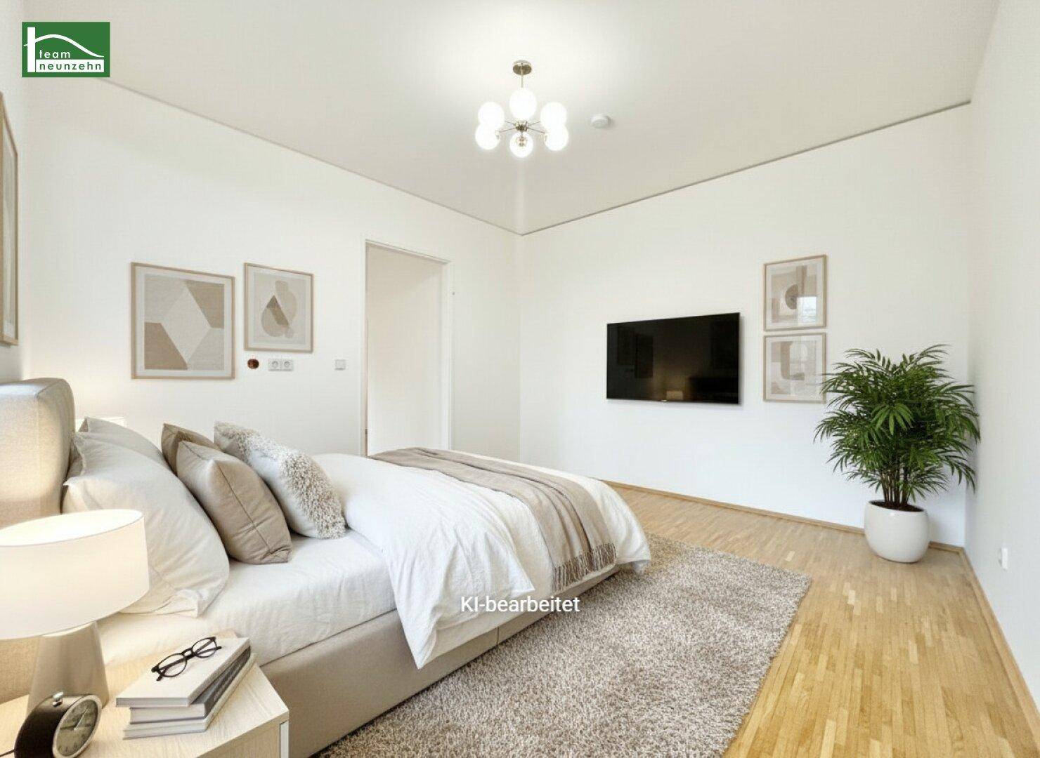 Geräumiges und helles Schlafzimmer mit Parkettboden und moderner Einrichtung.