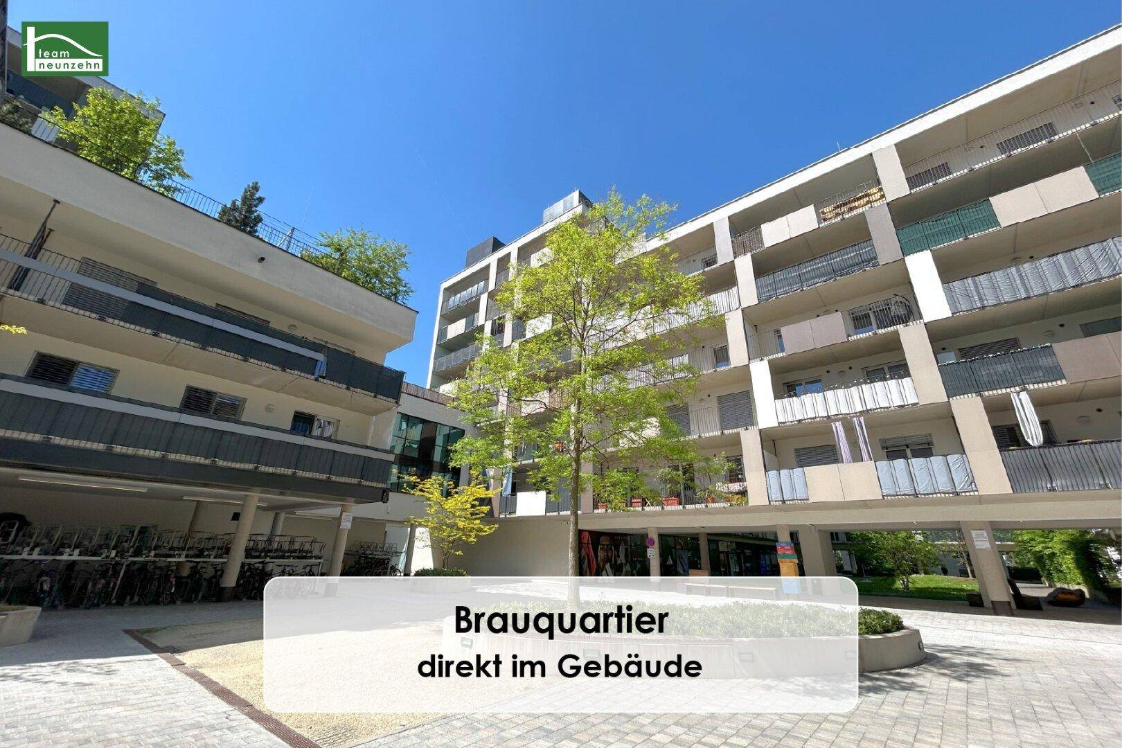 Moderne Wohngebäude des Brauquartiers mit Balkonen und begrünten Außenbereichen.