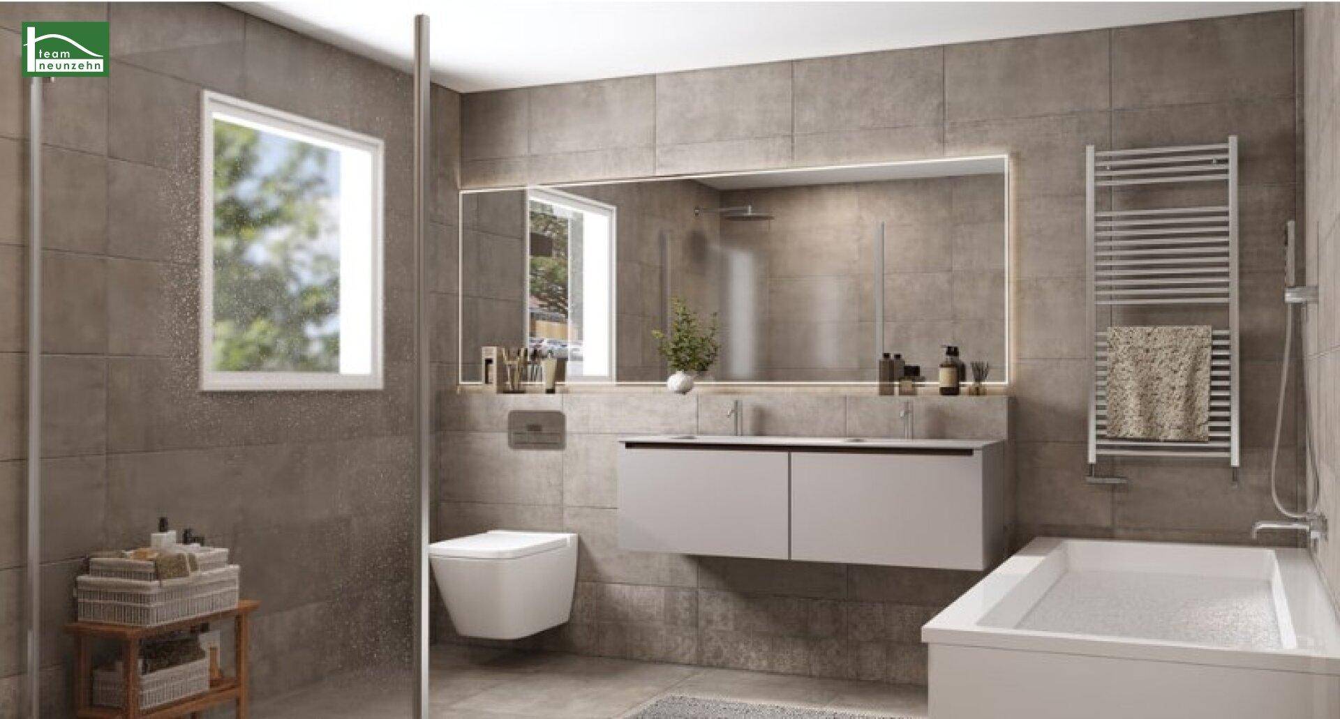 Modernes Badezimmer mit grauen Fliesen, schwebendem Waschtisch, Badewanne und Handtuchheizkörper.