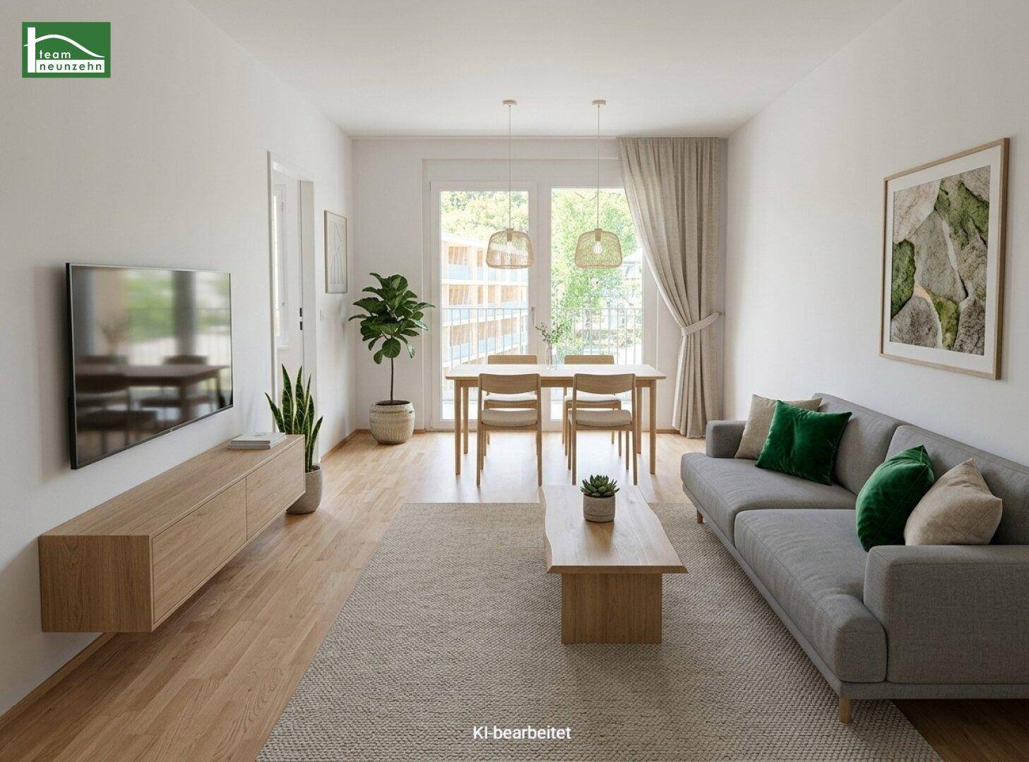 Modernes Wohn-Esszimmer mit Holzboden, bequemer Couch und Esstisch, hell und freundlich eingerichtet.