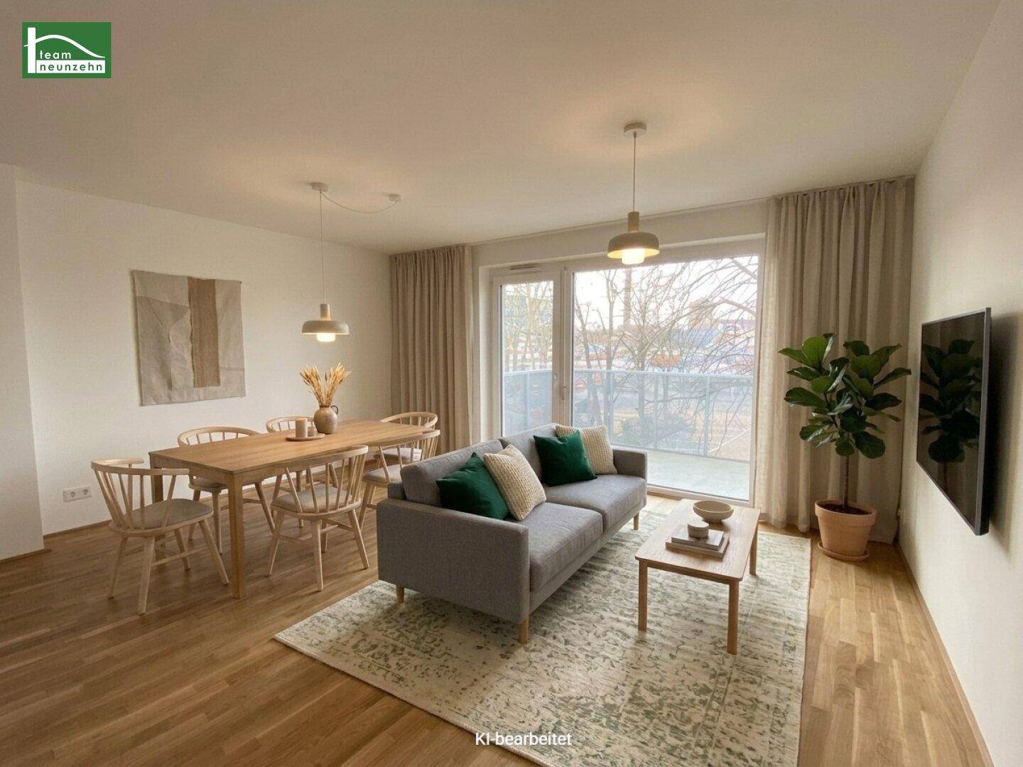 Modern eingerichteter Wohn-Essbereich mit Holzboden, Esstisch und gemütlichem Sofa.