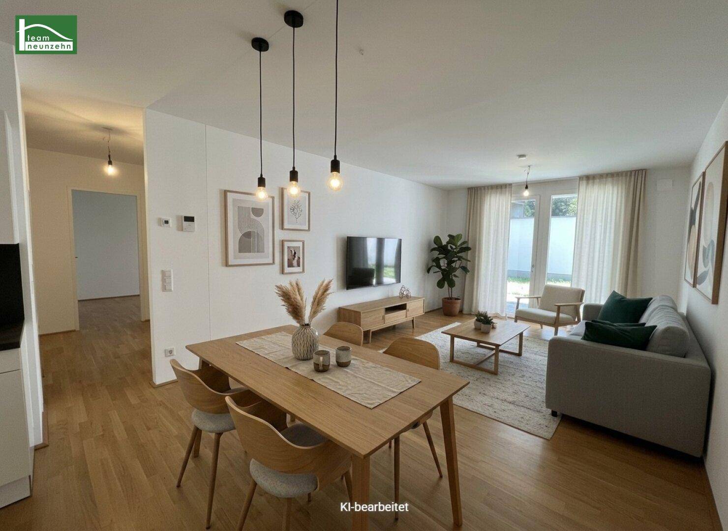 Modern eingerichteter Wohn-Essbereich mit Parkettboden und Zugang zur Terrasse.