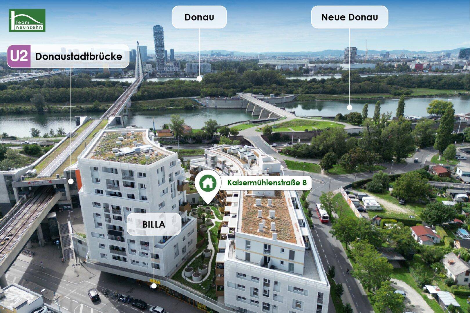 Luftaufnahme der Wohnanlage mit U-Bahn-Anschluss und Blick auf die Donau.