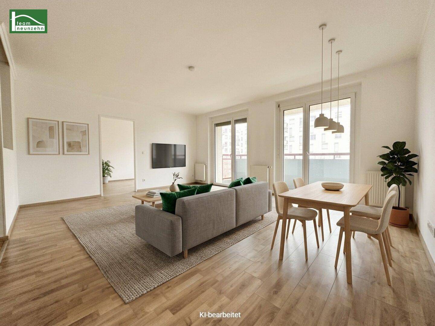 Modern eingerichteter Wohn-Essbereich mit Laminatboden und viel Tageslicht.