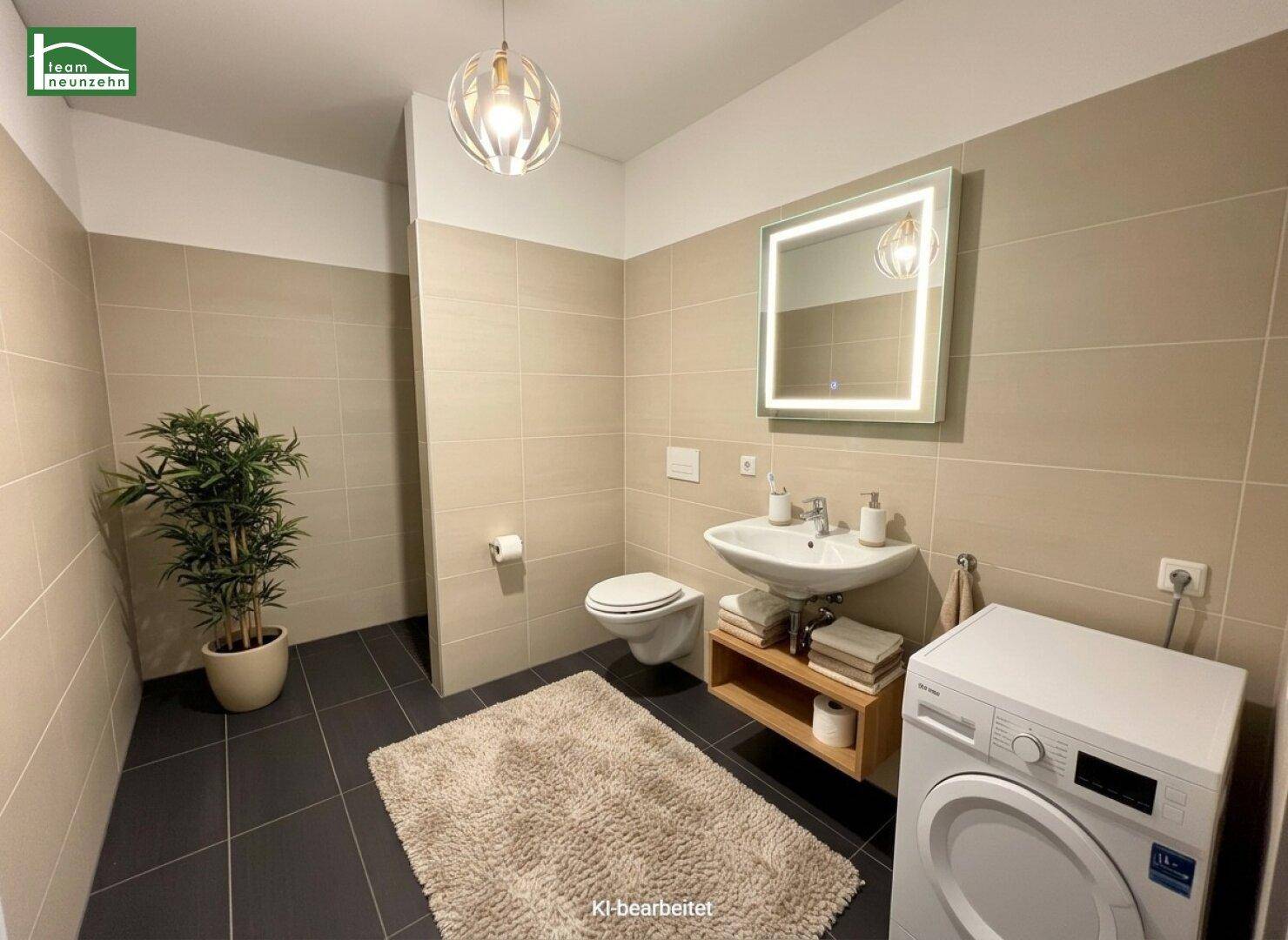 Modernes Badezimmer mit Waschbecken, wandhängender Toilette, Waschmaschine und dunklen Bodenfliesen.