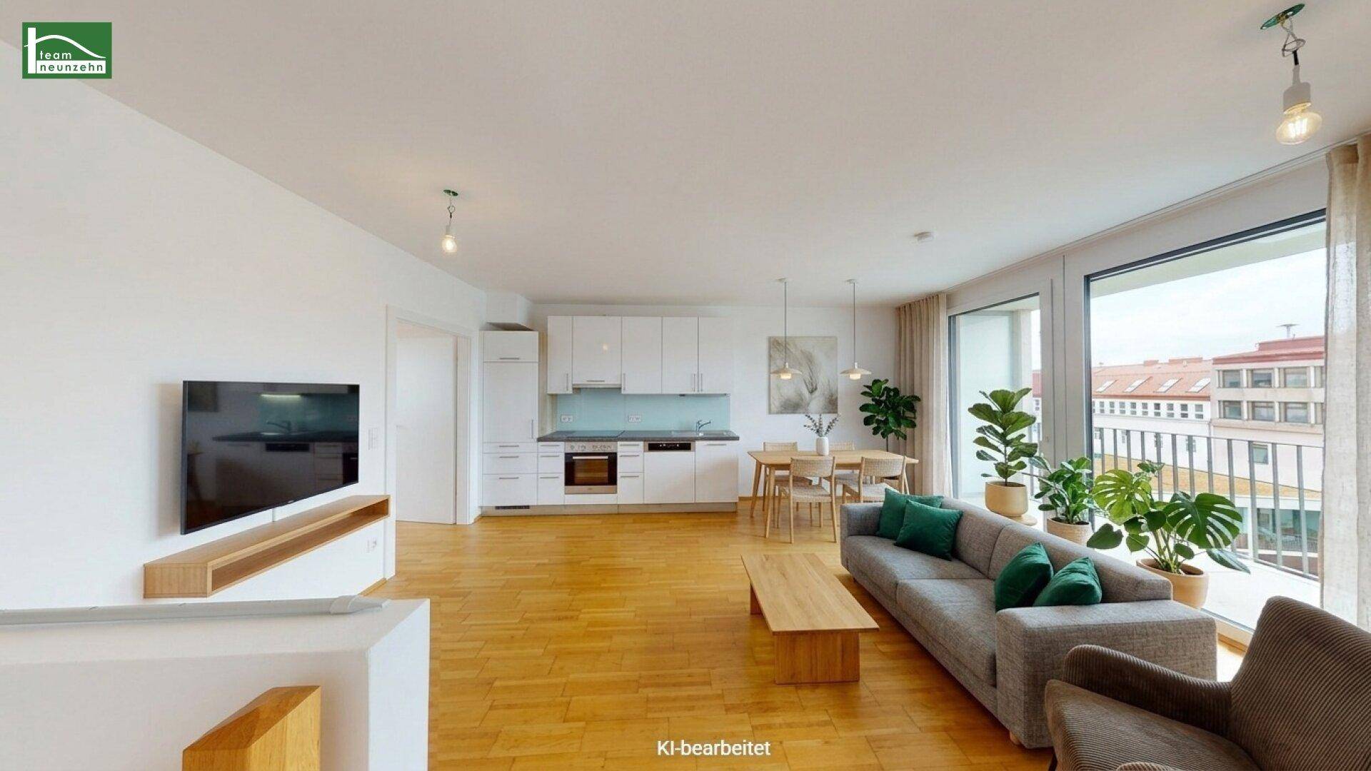 Heller, offener Wohn- und Essbereich mit moderner Einbauküche und Zugang zu einem Balkon mit Stadtblick.