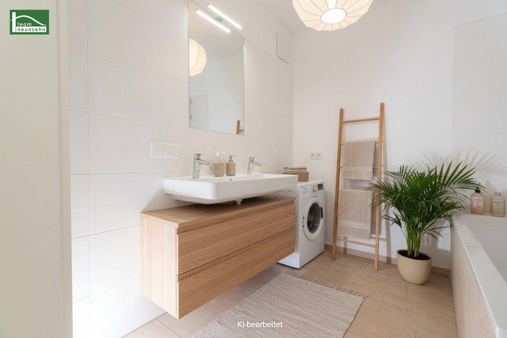 Modernes Badezimmer mit Doppelwaschbecken, Badewanne und Waschmaschine.