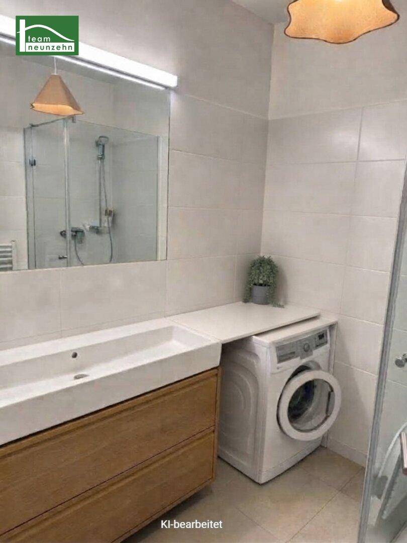 Modernes Badezimmer mit Waschbecken, Holzunterschrank, Spiegel und integrierter Waschmaschine.