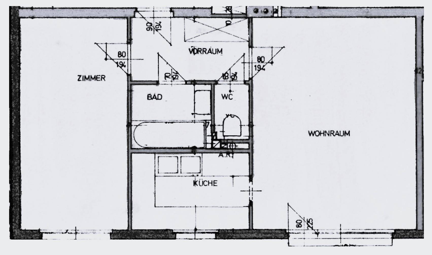 Grundrissplan der Wohnung mit Zimmer, Bad, WC, Küche und Wohnraum.
