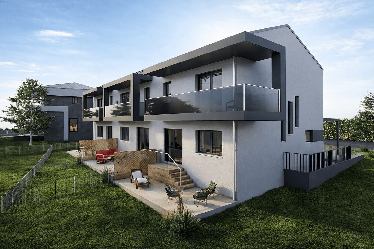 Seitenansicht der modernen Reihenhäuser mit großzügigen Balkonen und Terrassenbereichen.