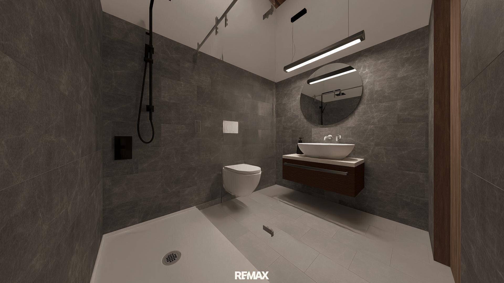 Modernes Badezimmer mit grauen Fliesen, schwebendem Waschtisch und großer begehbarer Dusche.
