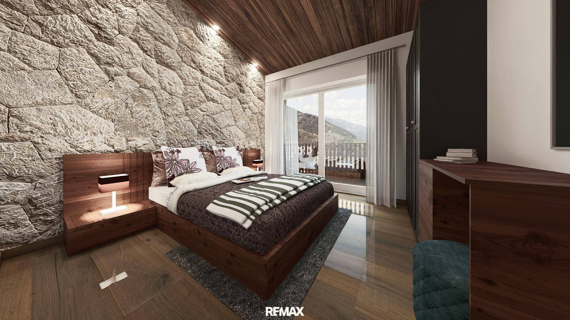 Gemütliches Schlafzimmer mit Steinwand, Holzbalkendecke und Balkonzugang mit malerischem Bergblick.
