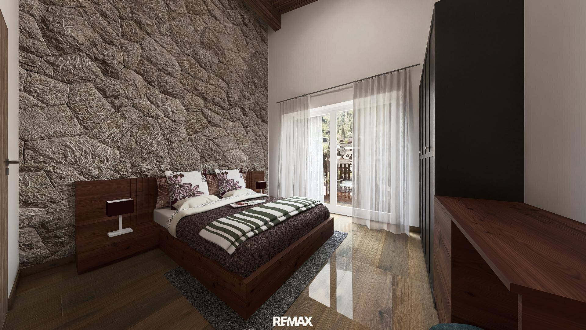 Geräumiges Schlafzimmer mit Holzboden, Steinwand und großen Fenstern, die viel natürliches Licht hereinlassen.