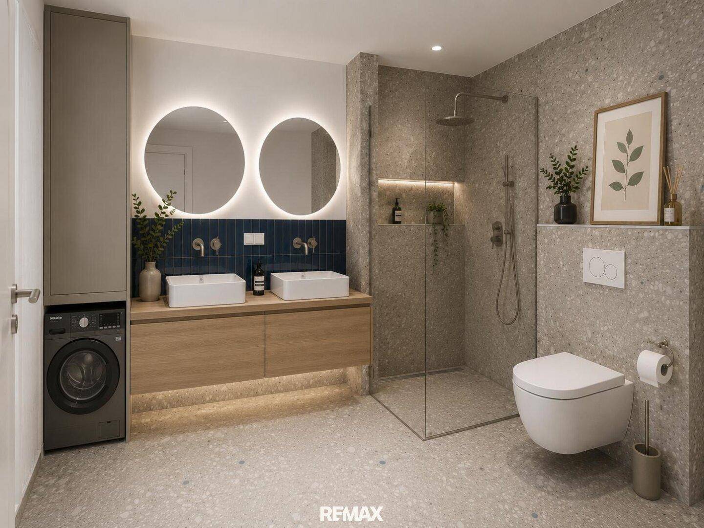 Geräumiges Badezimmer mit Doppelwaschbecken, Dusche und integrierter Waschmaschine.