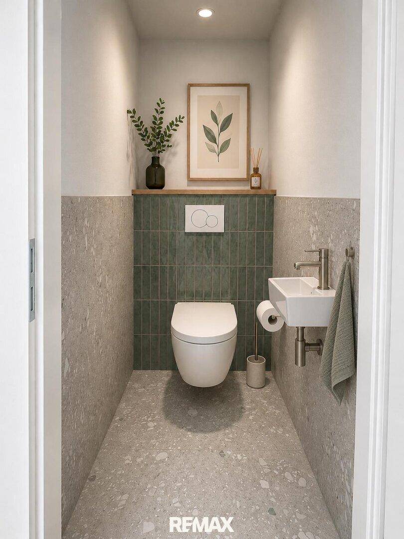 Kompaktes Gäste-WC mit modernem Design, kleinem Waschbecken und grünen Akzenten.