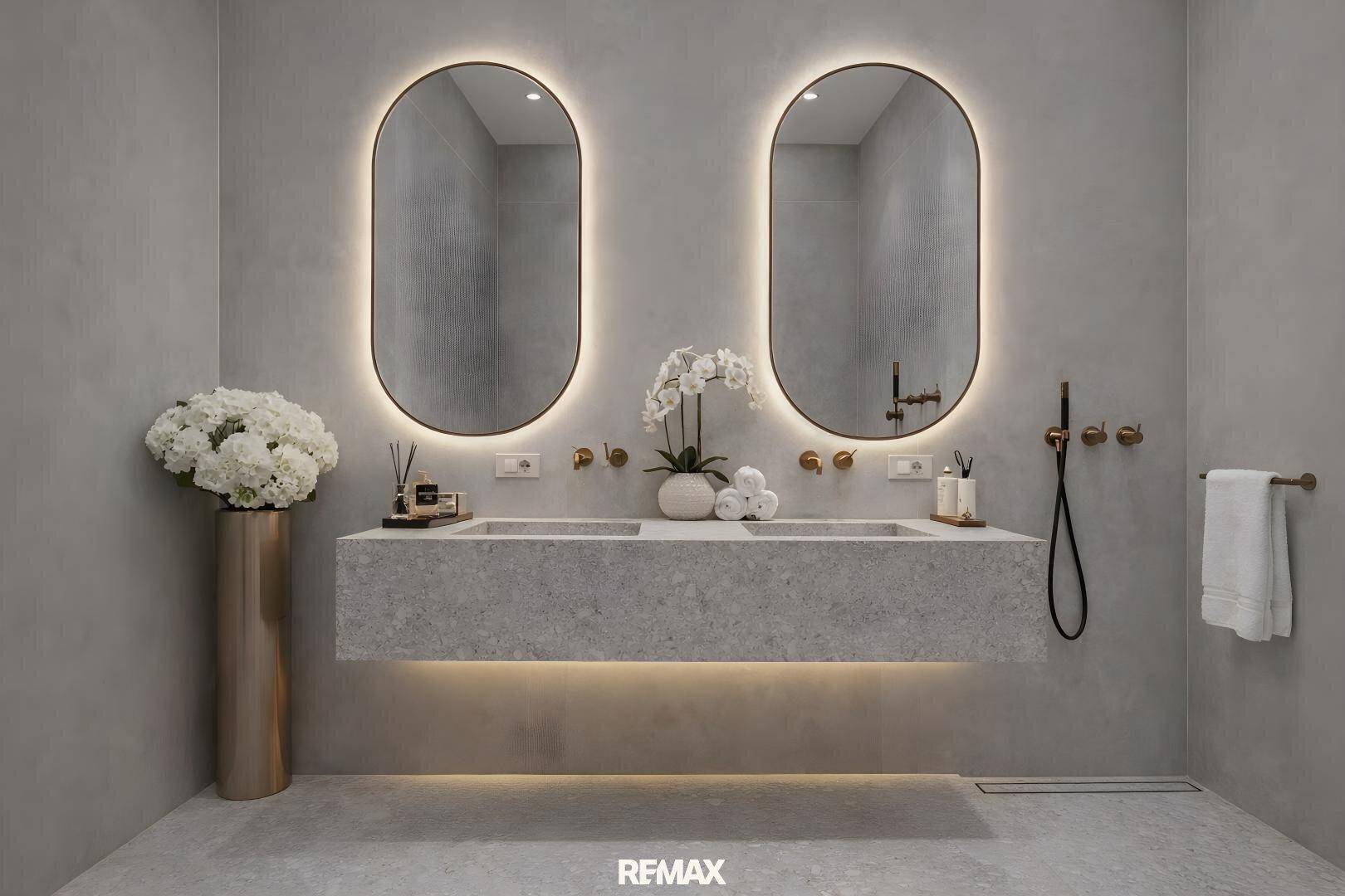 Modernes Badezimmer mit Doppelwaschbecken, beleuchteten Spiegeln und grauen Fliesen.