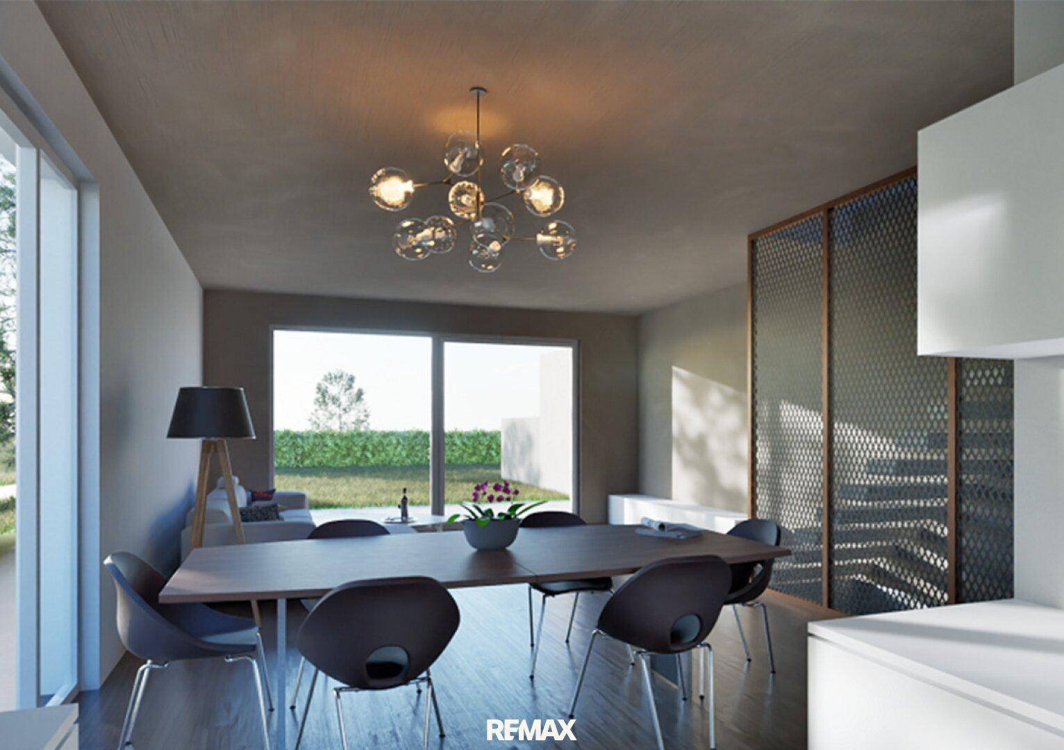Heller Essbereich mit modernem Esstisch, Designerleuchte und Zugang zum Garten.