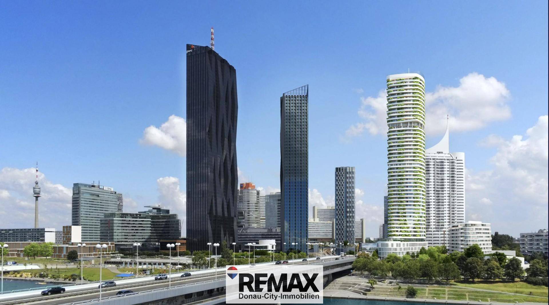 Panoramablick auf die moderne Wiener Skyline mit markanten Hochhäusern und Brücke.