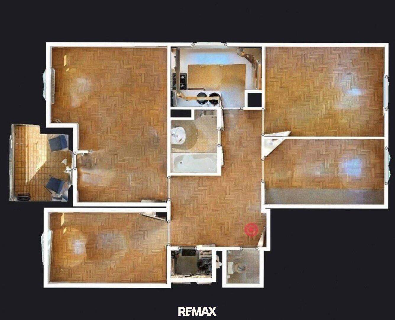 Grundriss der Wohnung mit mehreren Zimmern, Küche, Bad und Balkon.