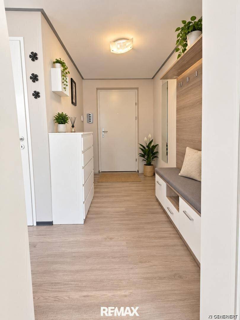 Einladender Eingangsbereich mit Garderobe, Sitzbank und praktischem Stauraum.