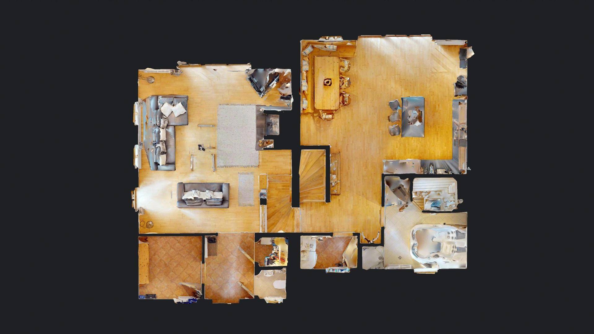 Grundriss des Erdgeschosses mit Wohnbereich, Küche und Esszimmer.