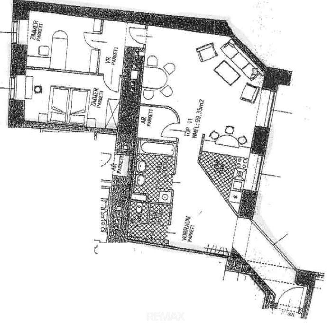 Grundrissplan einer Wohnung mit offenem Wohnbereich, zwei Zimmern und Balkon.