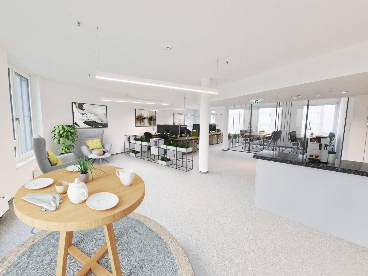 Heller Pausenbereich mit Holztisch und Sitzgelegenheiten, angrenzend an offene Büroräume mit Glaswänden.