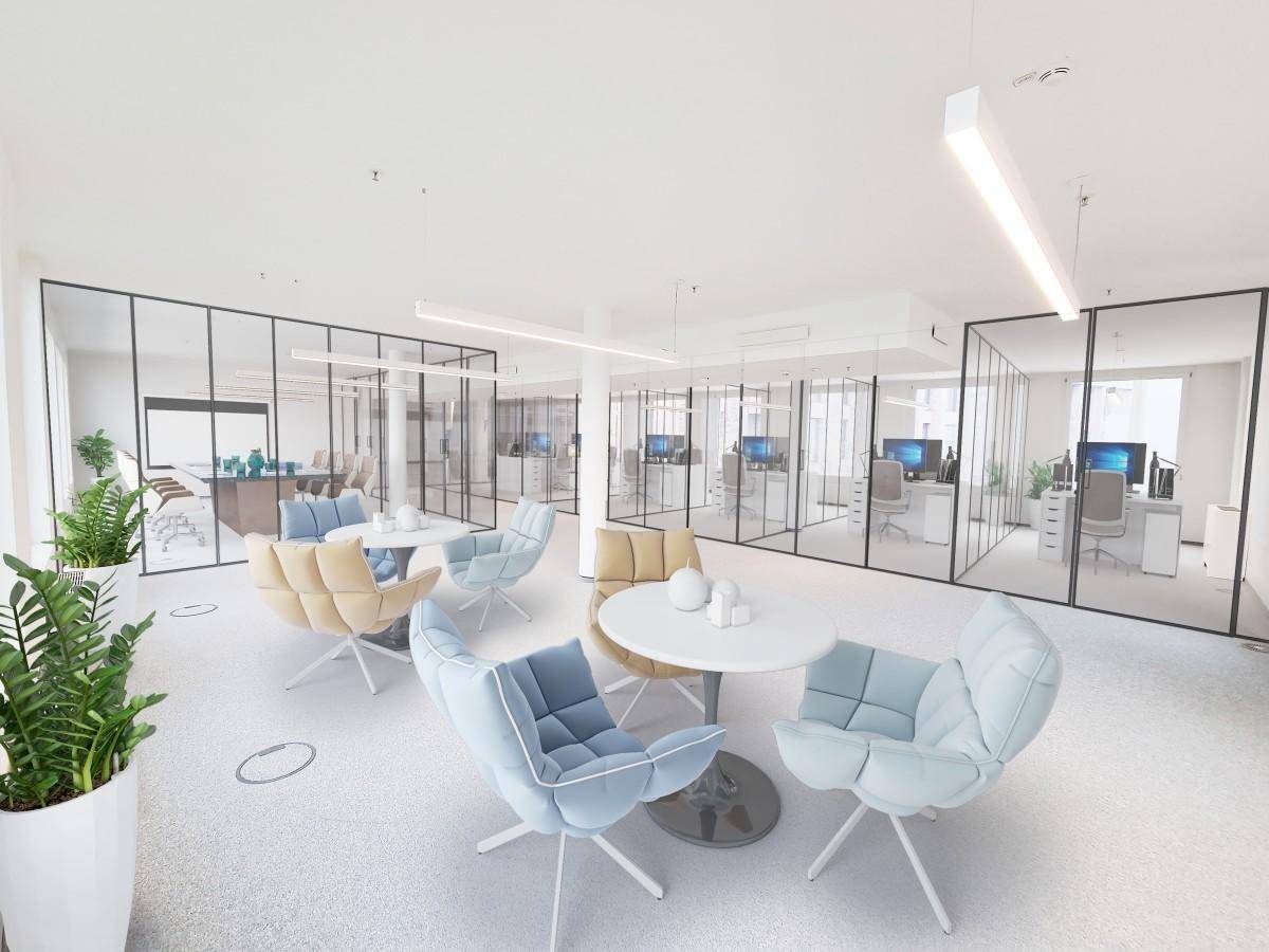 Farbenfroher Lounge-Bereich in einem modernen Büro mit bequemen Sesseln und Glasabtrennungen.