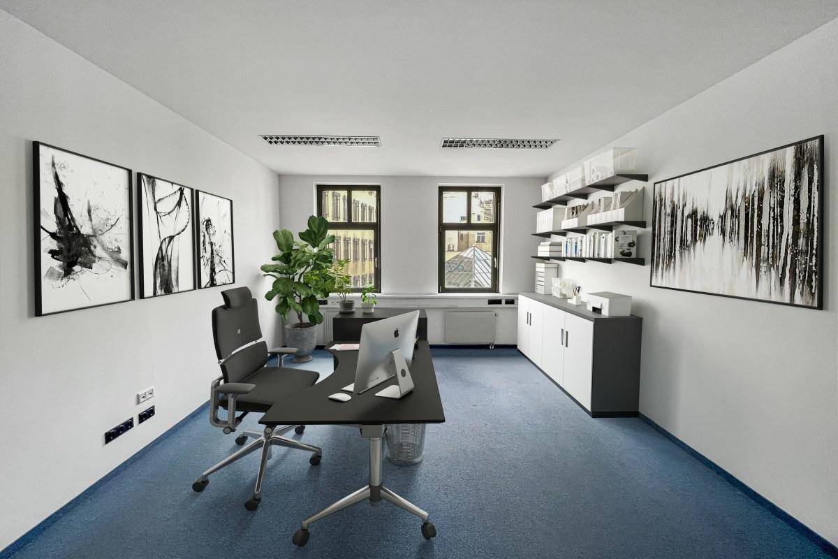 Einzelbüro mit blauem Teppichboden, modernem Schreibtisch, Bürostuhl und dekorativen Bildern an den Wänden.