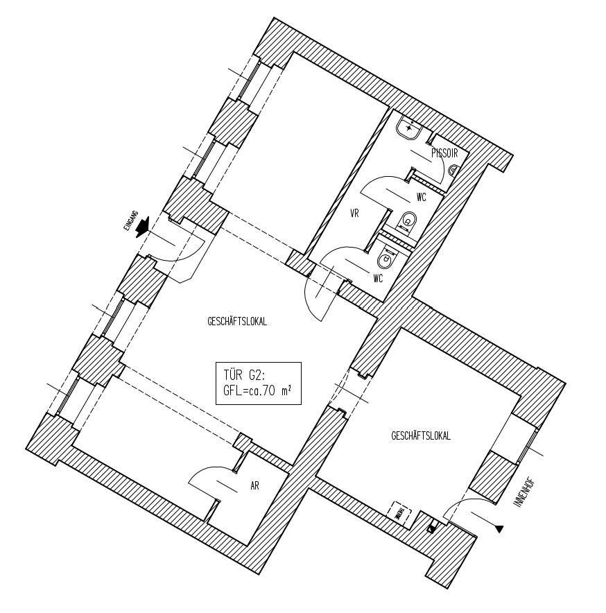 Grundriss eines Geschäftslokals mit mehreren Räumen, einem Eingangsbereich und separaten Toiletten.