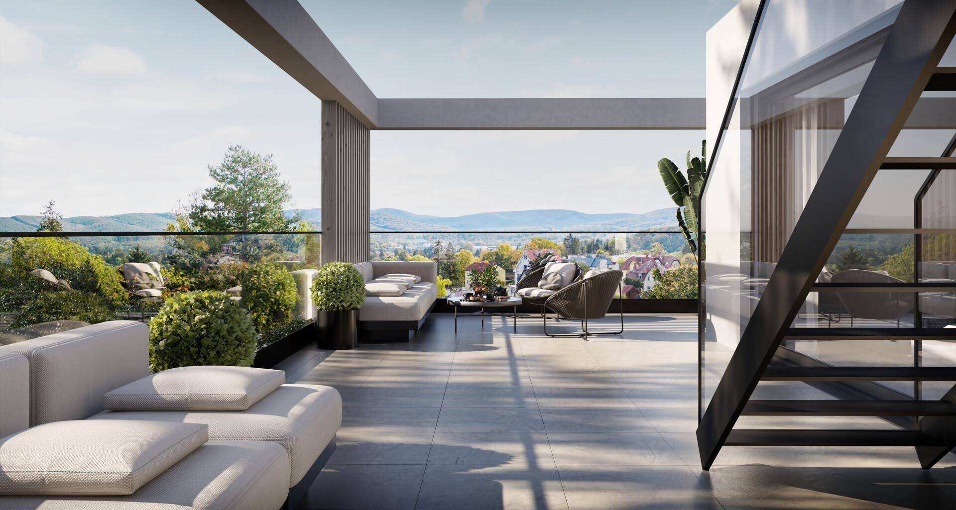 Großzügige Dachterrasse mit Lounge-Möbeln und weitem Blick über die Landschaft.