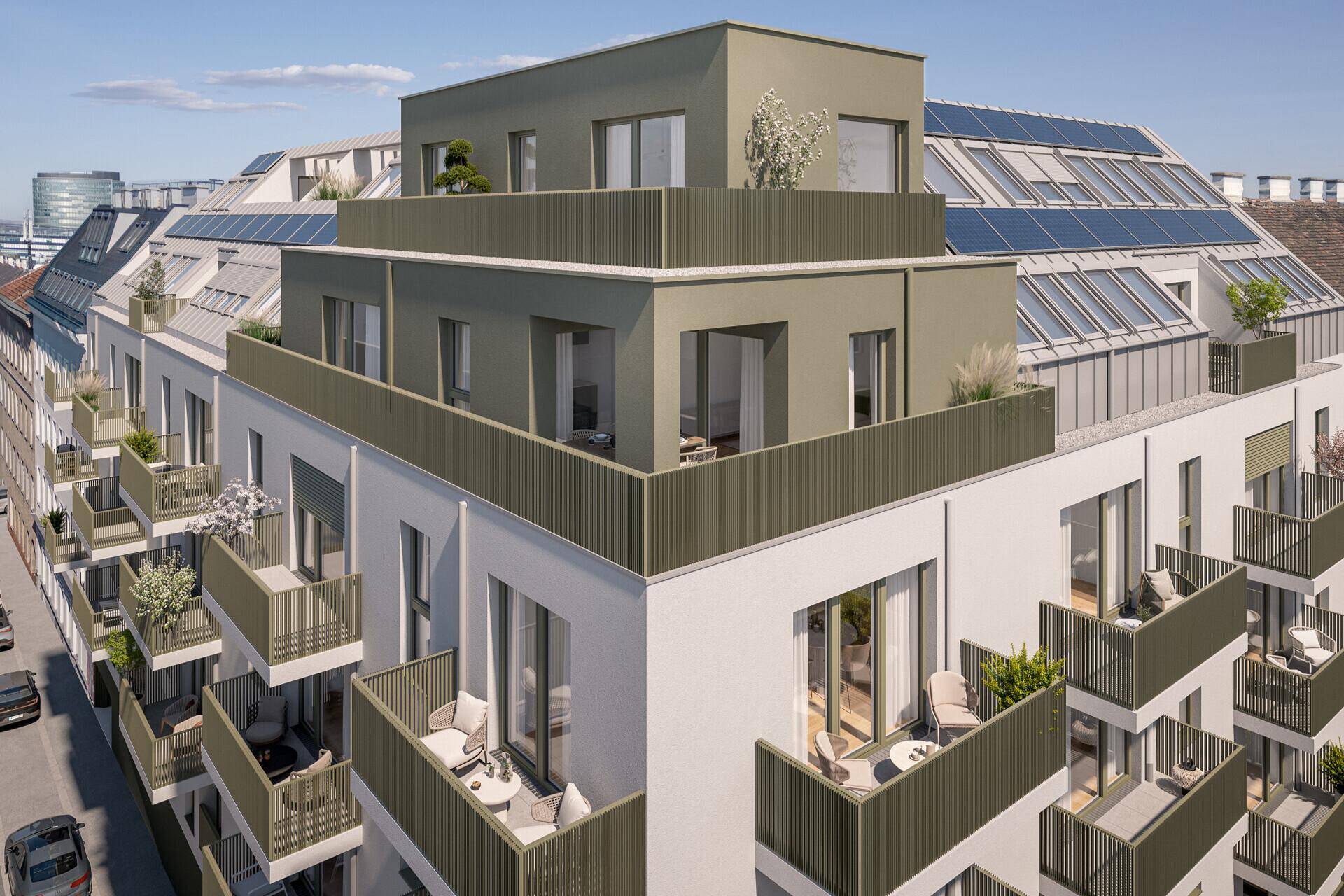Dachansicht einer modernen Wohnanlage mit Photovoltaikanlage und begrünten Terrassen.