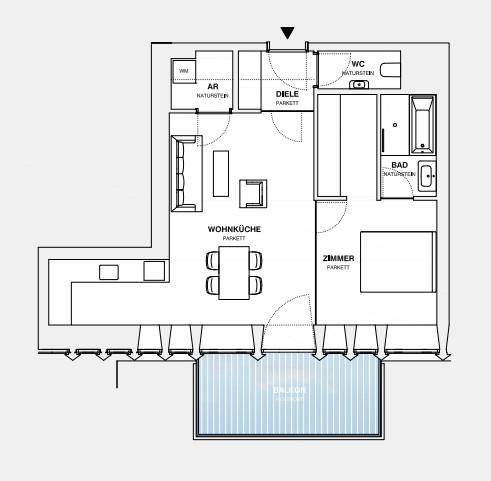 Grundriss einer Wohnung mit Wohnküche, Schlafzimmer, Bad und Balkon.