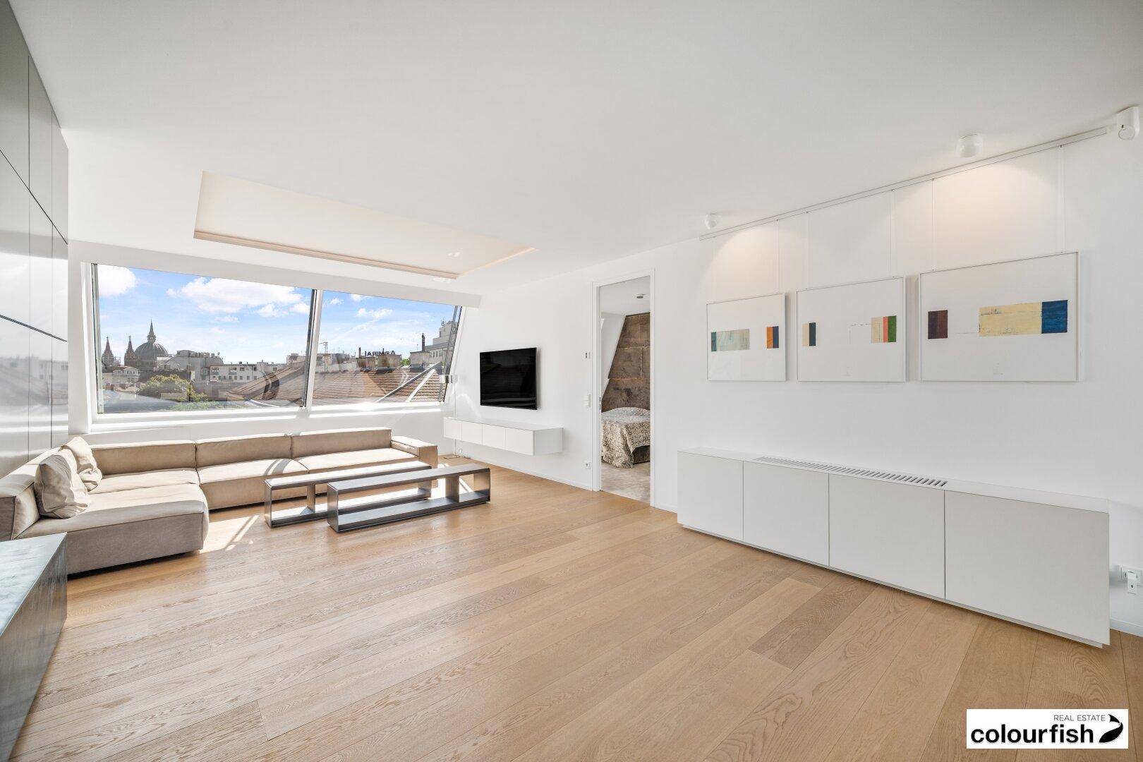 Traumhafte Dachgeschoßwohnung mit großzügiger Dachterrasse in perfekter Lage steht zum Verkauf - inklusive 2 Garagenstellplätzen und Möblierung - Ansicht 2