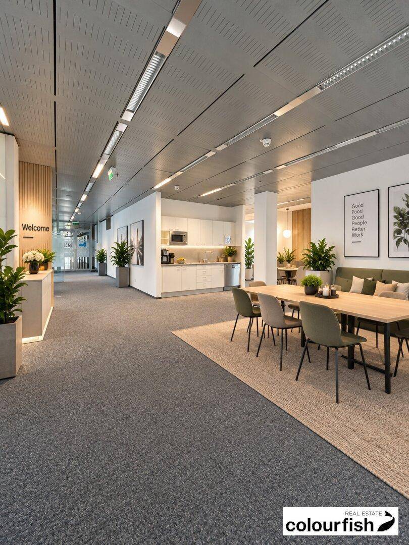 Offener Bürobereich mit Teeküche und Essbereich, ideal für Pausen und informelle Treffen.